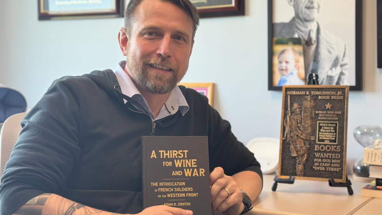 Adam Zientek with the Norman B. Tomlinson Jr. Prize