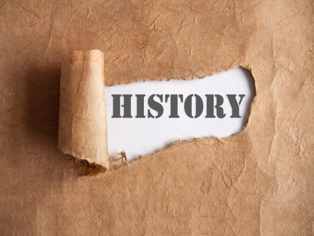 torn brown paper with the word history shown behind