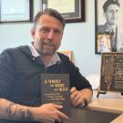 Adam Zientek with the Norman B. Tomlinson Jr. Prize